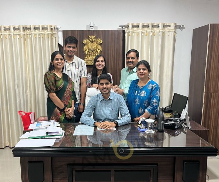 Kanishak Kataria with his Family in his office